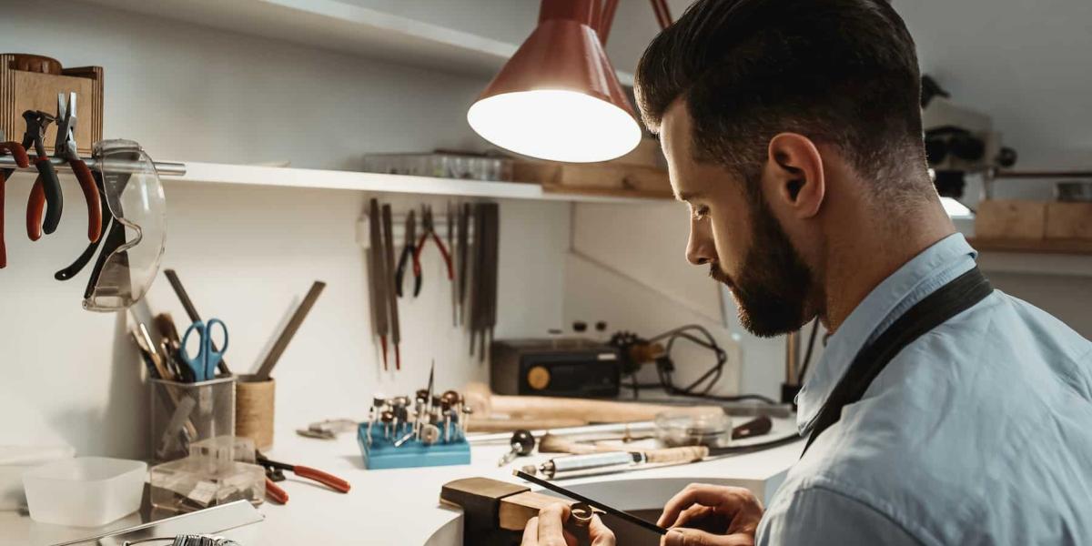 Photo of a men working on a piece of jewellery