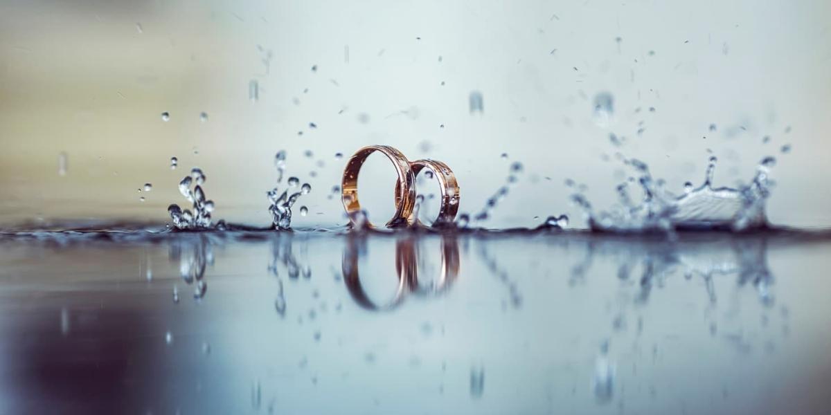 Rings in water showing splashes and reflection